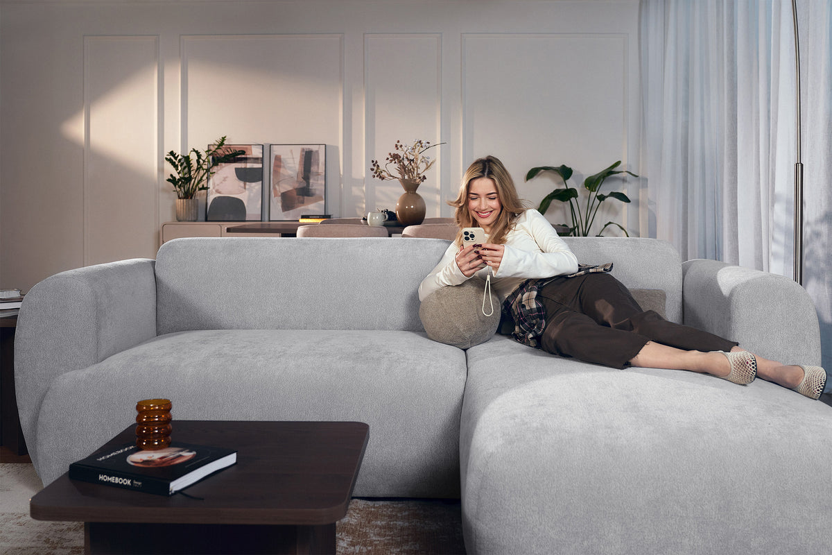 Canapé d'angle droit Emia avec fonction couchage, tissu chenille gris