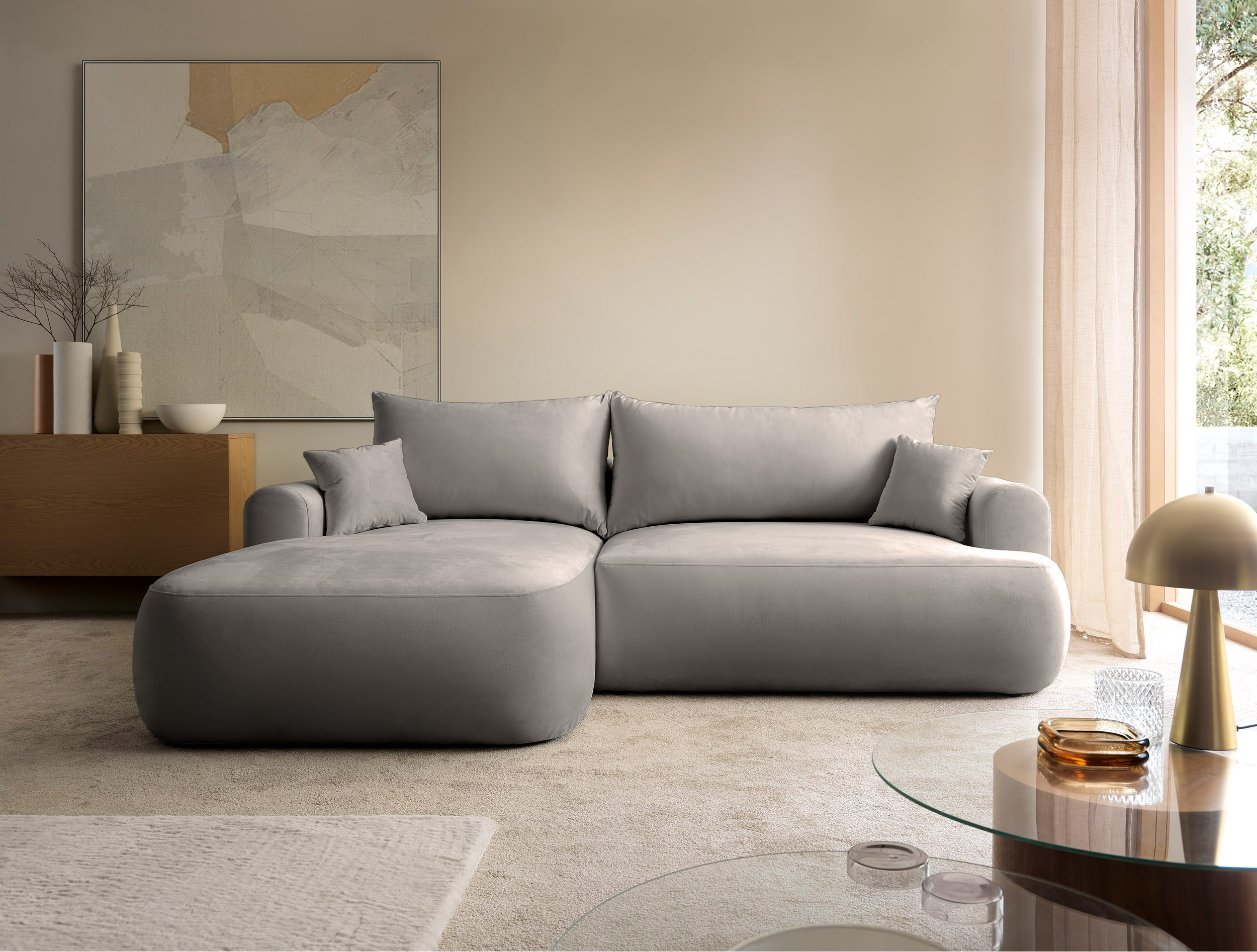 Jasnoszary narożnik Ovo lewostronny z funkcją spania i pojemnikiem na pościel.