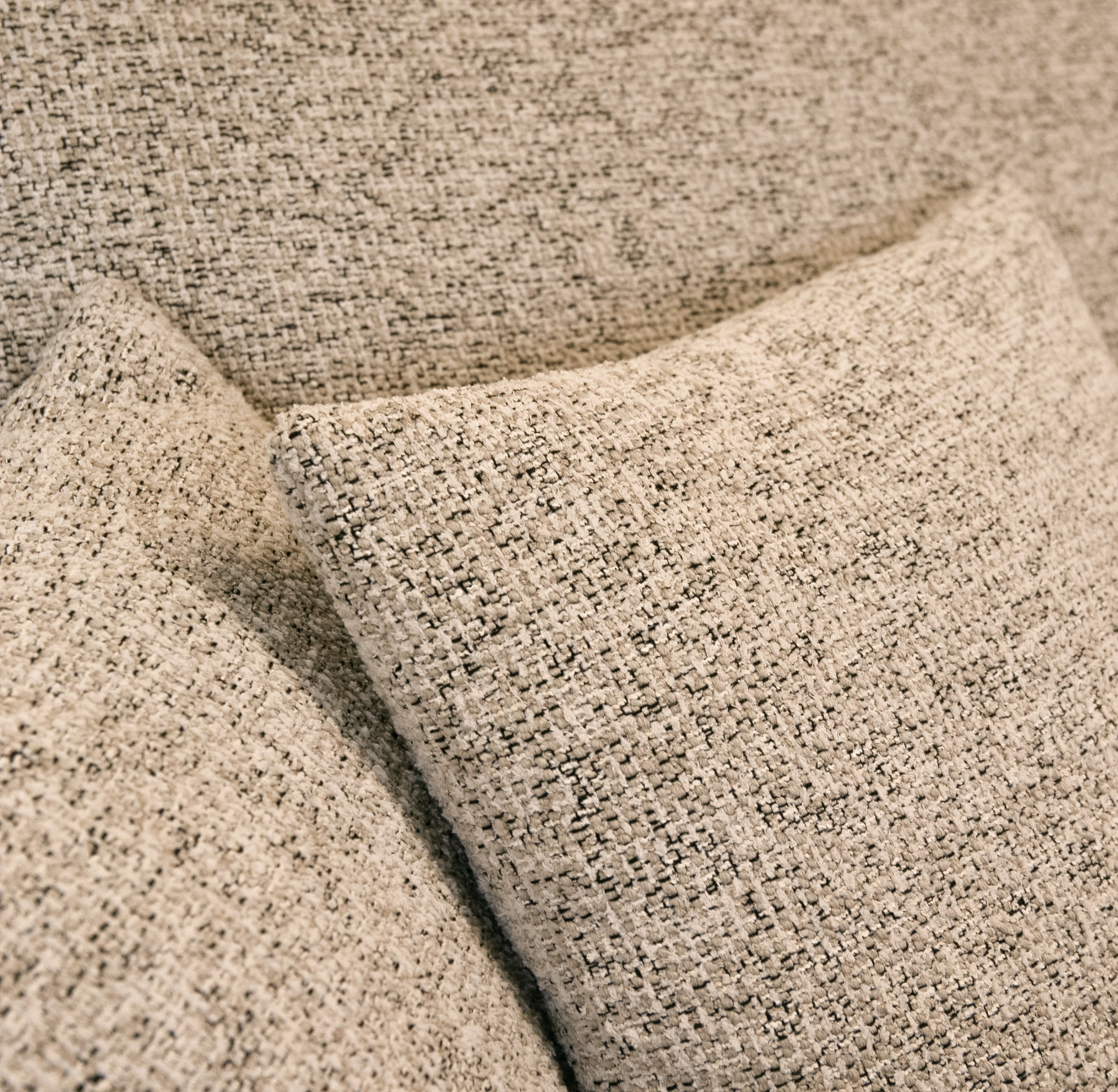 Jasnoszary narożnik Ovo lewostronny z funkcją spania i pojemnikiem na pościel.