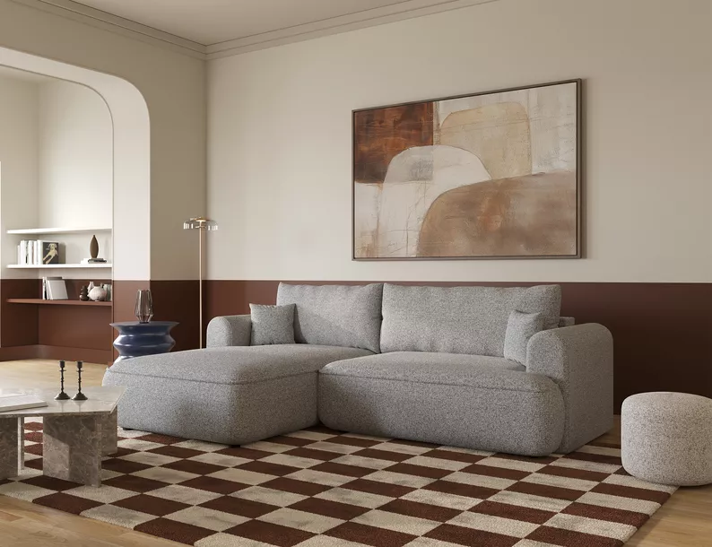 Jasnoszary narożnik Ovo lewostronny z funkcją spania i pojemnikiem na pościel.