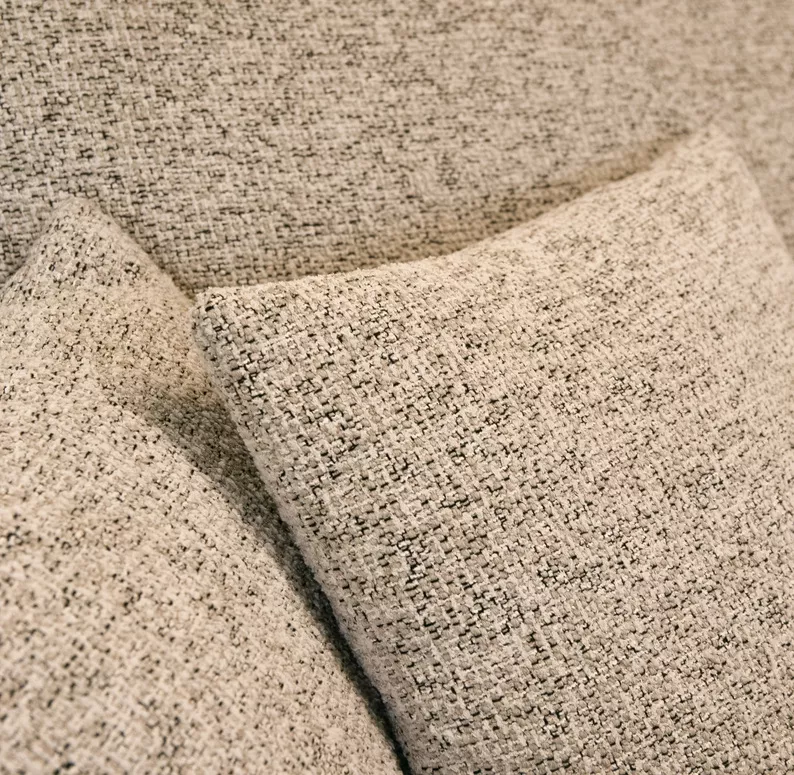 Jasnoszary narożnik Ovo lewostronny z funkcją spania i pojemnikiem na pościel.