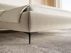 Łóżko tapicerowane 180x200 cm Roule z pojemnikiem stelaż metalowy jasnobeżowe welur hydrofobowy nóżki czarne