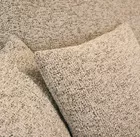 Jasnoszary narożnik Ovo lewostronny z funkcją spania i pojemnikiem na pościel.